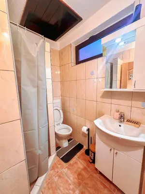 a bathroom with a sink and a toilet at Stan na dan Relax in Bosanska Dubica