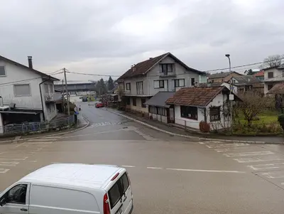 a white van parked on the side of a street at Stan na dan Relax in Bosanska Dubica