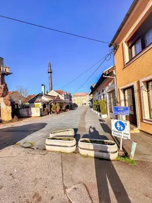 an empty street in a small town with at Stan na dan Relax in Bosanska Dubica