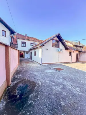 an empty parking lot in front of a house at Stan na dan Relax in Bosanska Dubica