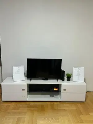 a flat screen tv sitting on a white entertainment center at Apartman Moskva in Teslić