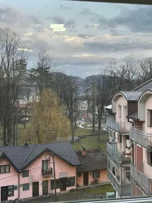 a group of houses in a town with trees at Apartman Moskva in Teslić