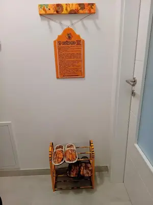 a display of donuts on a cart against a wall at Apartman MED in Doboj
