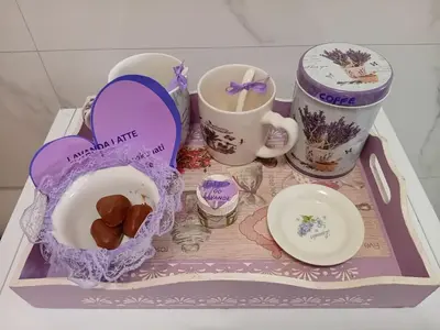 a tray with a tray of food and cups andocolates at Apartman MED in Doboj