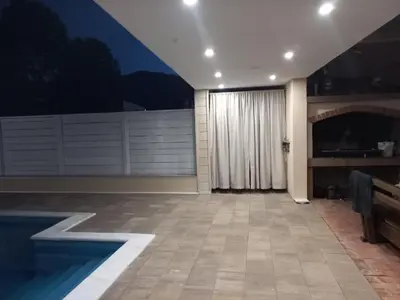 a living room with a swimming pool in a house at Villa Aida in Bihać