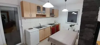 a kitchen with a white refrigerator and a sink at Villa Aida in Bihać