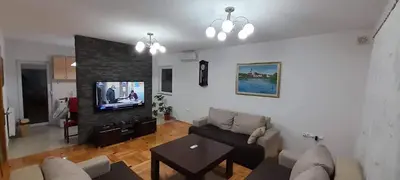 a living room with a couch and a tv at Villa Aida in Bihać