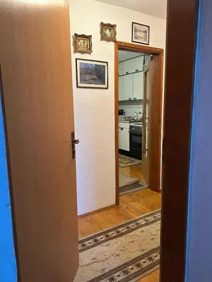 an open door to a kitchen in a house at Apartman Kuna in Kupres