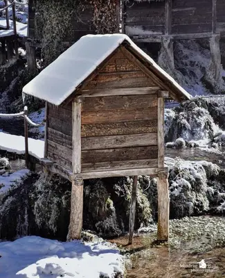 a wooden bird house with snow on top of it at Nurr in Jajce