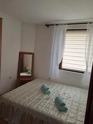 a bedroom with a bed with two towels on it at Nurr in Jajce