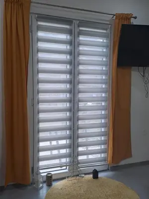 a large window with shutters in a room at Nurr in Jajce