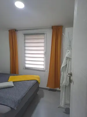 a bedroom with a bed and a window at Nurr in Jajce