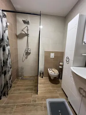 a bathroom with a shower and a toilet at Apartman Mrša in Livno