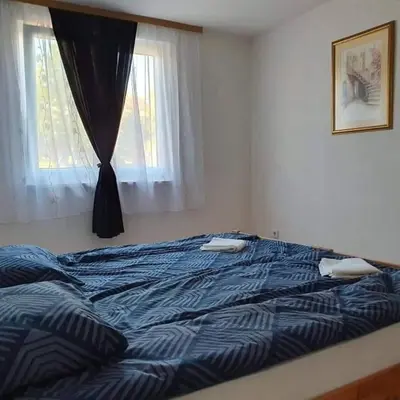 a large bed in a bedroom with a window at Luxury Villa Tale - Una in Ripač