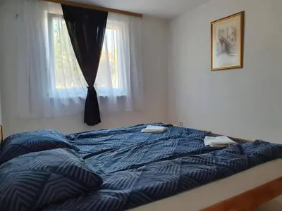 a bed in a bedroom with a window at Luxury Villa Tale - Una in Ripač