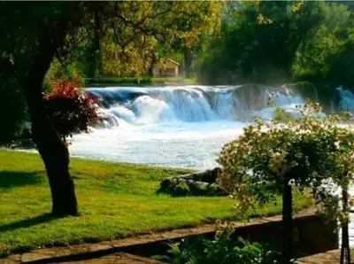 a view of a river with a waterfall at Luxury Villa Tale - Una in Ripač