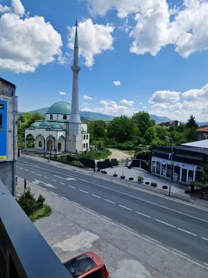 a view of a mosque and a road with a building at Apartman Pasha in Bihać