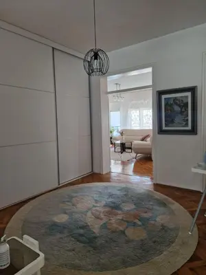 a living room with a large rug on the floor at Apartman Pasha in Bihać