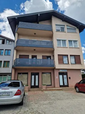 a building with a car parked in front of it at Apartman Pasha in Bihać
