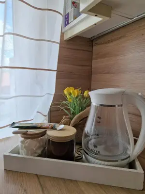 a coffee maker on a tray in a kitchen at Apartman Pasha in Bihać
