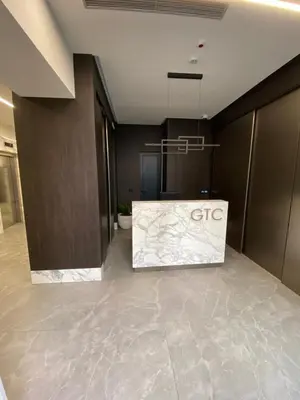 an office lobby with a ceo sign on the floor at Metropolis Apartman in Banja Luka