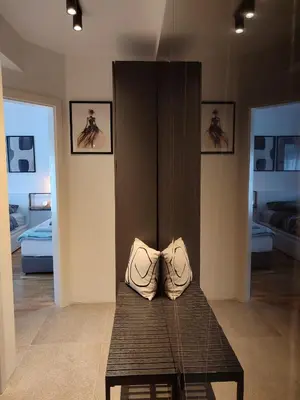 a room with a table with two bags on it at River Oasis in Banja Luka