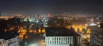 a view of a city at night with lights at Apartman LUAN5 centar in Banja Luka