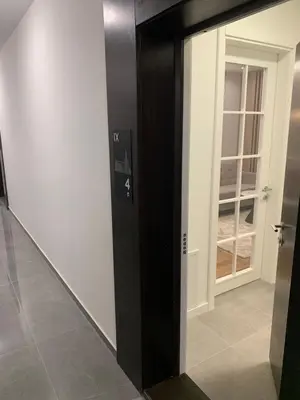 a mirror in a room with a door at Apartman LUAN5 centar in Banja Luka
