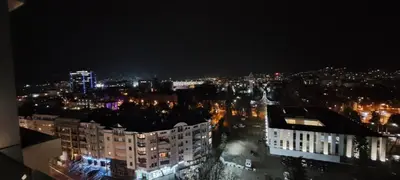 a view of a city at night with lights at Apartman LUAN5 centar in Banja Luka