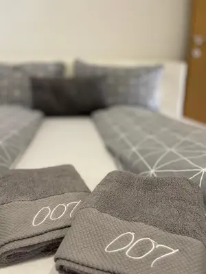 a bed with two towels on top of it at Apartman 007 in Jajce