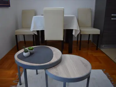 a room with two tables and two stools at ViGoSt in Banja Luka