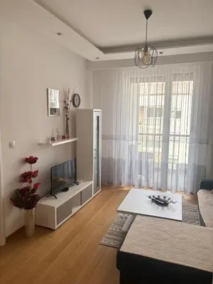 a living room with a couch and a tv at Apartman 888 in Banja Luka