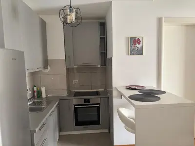 a kitchen with a sink and a stove top oven at Apartman 888 in Banja Luka
