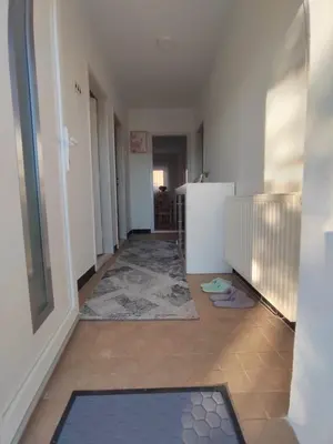 a hallway with a door and a tile floor at VERANIJE Apartman in Livno