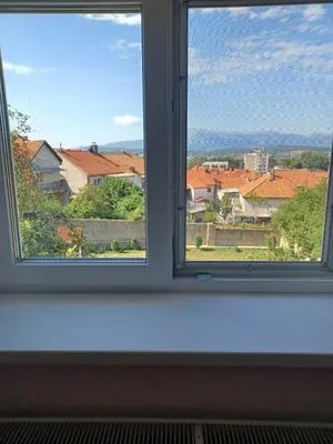 a window with a view of a city at VERANIJE Apartman in Livno