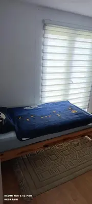 a bed in a room with a window at Faris in Bihać
