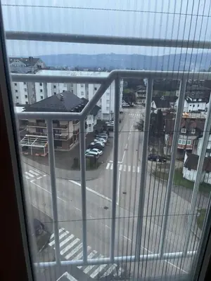 a view of a city street from a window at Stan Centar in Sanski most