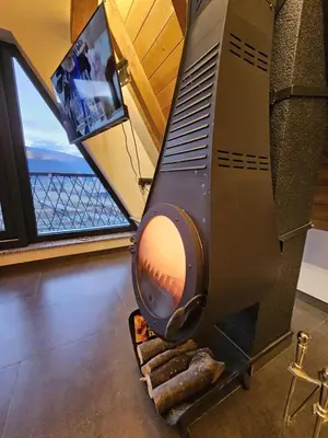 a stove in a room with a view of the ocean at Luxury Villa Mašić in Čardaci