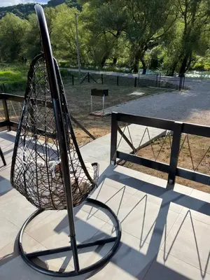 a metal basket sitting on top of a fence at Vila Jezero-Jajce in Jezero