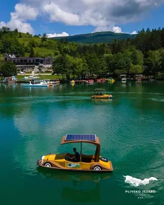 a solar boat in the water on a lake at Vila Jezero-Jajce in Jezero