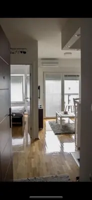 a living room with a couch and a table at Apartmani LUX Tamara in Banja Luka