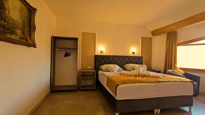 a bedroom with a bed and a window at Wellness Spa Hotel Zeleni Raj in Banja Luka