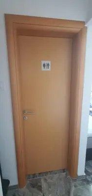 a door in a room with a sign on it at Apartman Katić in Odžak