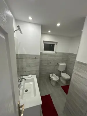 a bathroom with a sink and a toilet at Apt Amor in Bihać