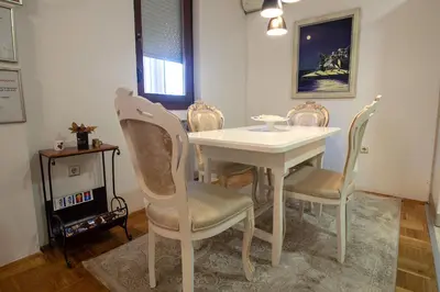 a white table and chairs in a room at Apartment Barby - Aleja in Banja Luka