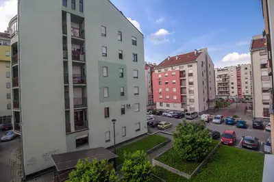 a view of a city with buildings and a parking lot at Apartment Barby - Aleja in Banja Luka