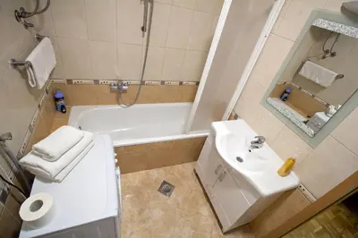 a bathroom with a toilet and a sink and a tub at Apartment Barby - Aleja in Banja Luka