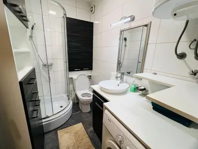 a bathroom with a sink and a toilet and a shower at Apartman Tara 11 in Banja Luka