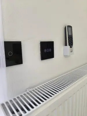 a wall with a cell phone and a cell phone at Apartman Vanja in Doboj