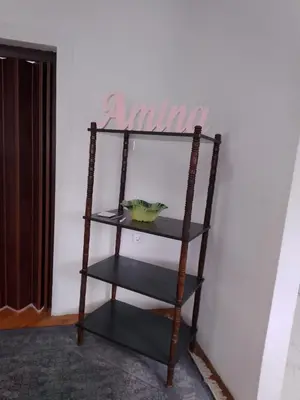 a shelf in the corner of a room at Apartmani Amina in Bihać